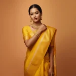 A Graceful Indian Woman in a Vibrant Yellow Saree with Traditional Jewelry | traditional saree prompt for girl instagram